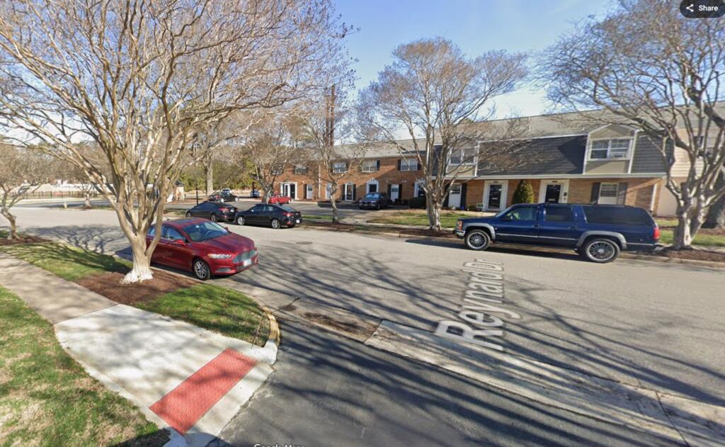 Modern photograph of the same Virginia Beach neighborhood where a couple stood decades earlier, showing the location years later.
