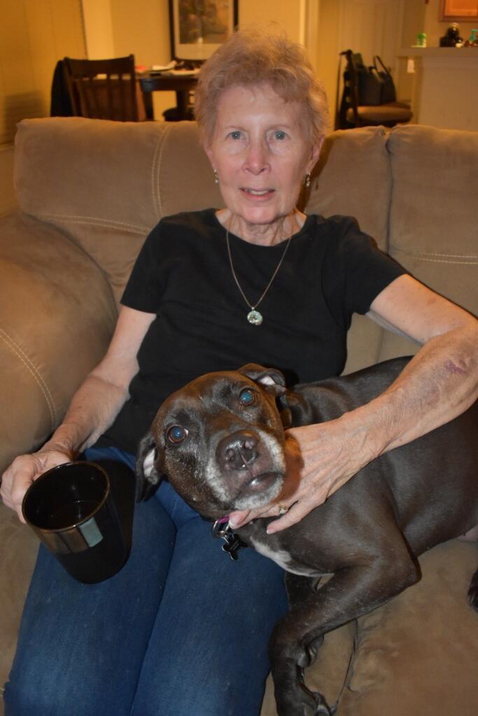 Wilma Gartrell visiting family in Florida in later years, holding Riley the family dog